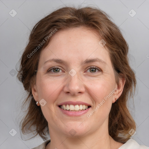 Joyful white adult female with medium  brown hair and grey eyes