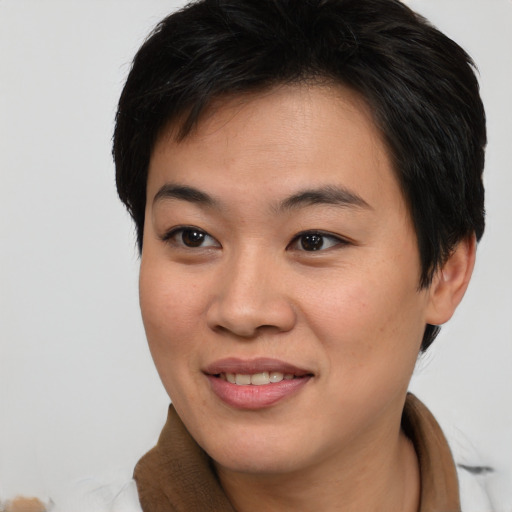 Joyful asian young-adult female with medium  brown hair and brown eyes