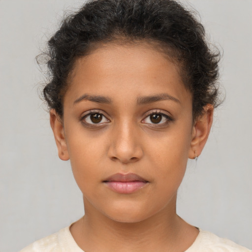Neutral latino child female with short  brown hair and brown eyes