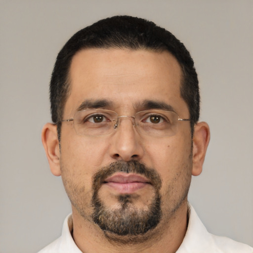 Neutral latino adult male with short  black hair and brown eyes