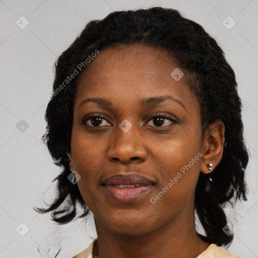 Joyful black adult female with medium  black hair and brown eyes