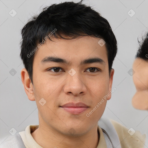 Joyful asian young-adult male with short  brown hair and brown eyes