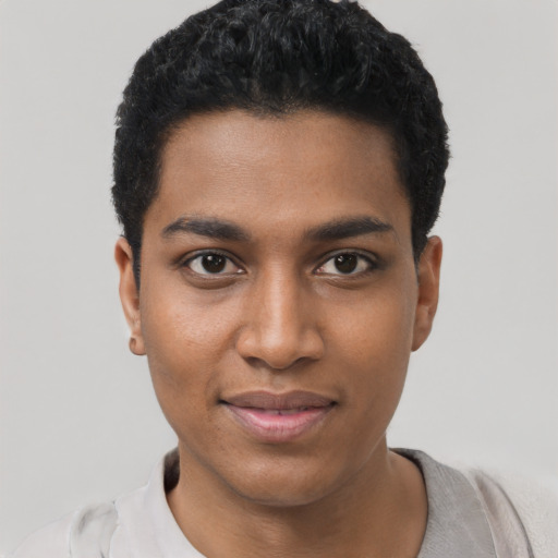 Joyful black young-adult male with short  black hair and brown eyes