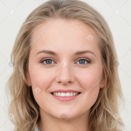 Joyful white young-adult female with long  brown hair and blue eyes