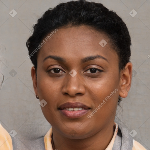 Joyful black young-adult female with short  brown hair and brown eyes