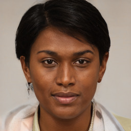 Joyful latino young-adult female with medium  brown hair and brown eyes