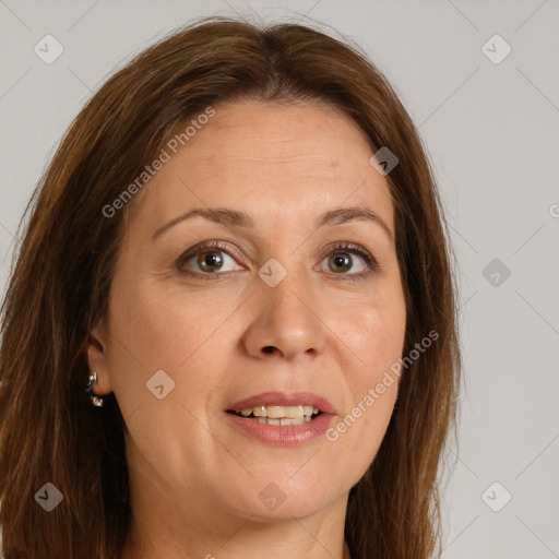 Joyful white adult female with long  brown hair and grey eyes