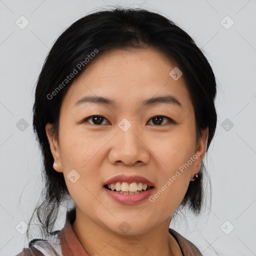 Joyful asian young-adult female with medium  black hair and brown eyes