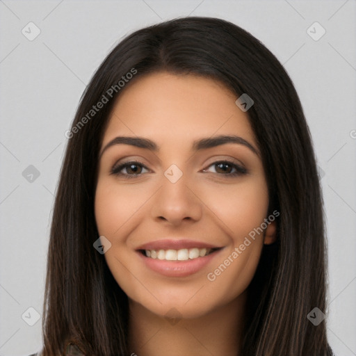 Joyful latino young-adult female with long  brown hair and brown eyes