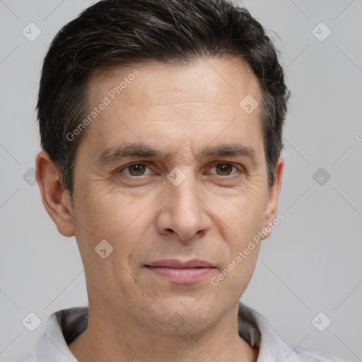 Joyful white adult male with short  brown hair and brown eyes