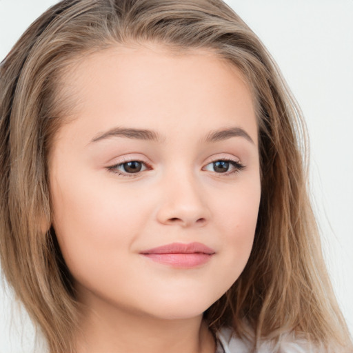 Joyful white child female with long  brown hair and brown eyes