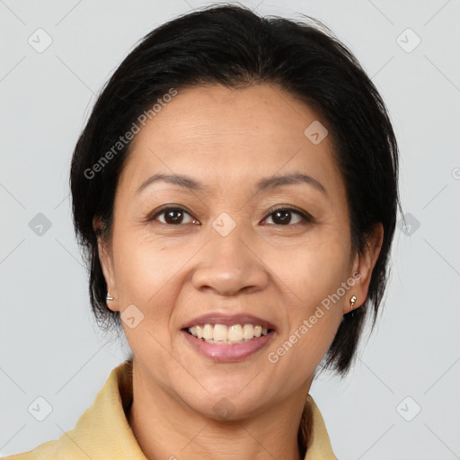 Joyful white adult female with medium  brown hair and brown eyes