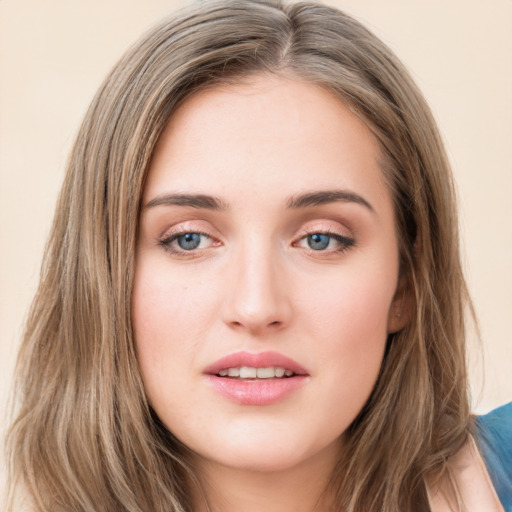 Joyful white young-adult female with long  brown hair and green eyes