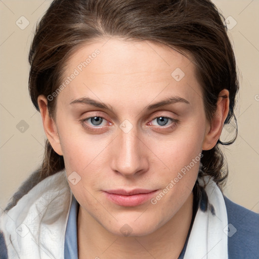 Joyful white young-adult female with medium  brown hair and blue eyes