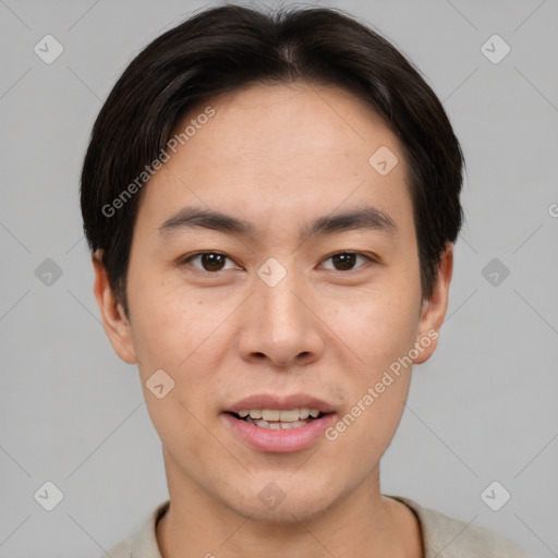 Joyful asian young-adult male with short  brown hair and brown eyes