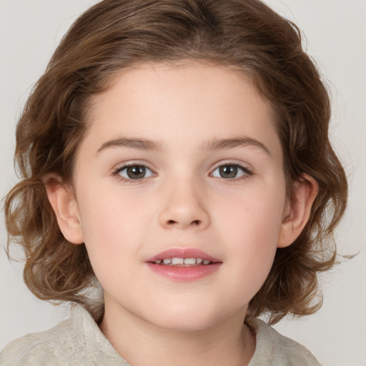 Joyful white child female with medium  brown hair and brown eyes