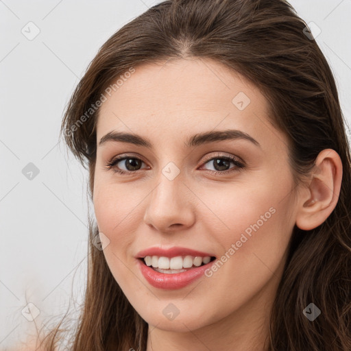 Joyful white young-adult female with long  brown hair and grey eyes