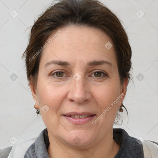 Joyful white adult female with short  brown hair and brown eyes