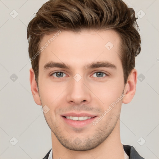 Joyful white young-adult male with short  brown hair and grey eyes