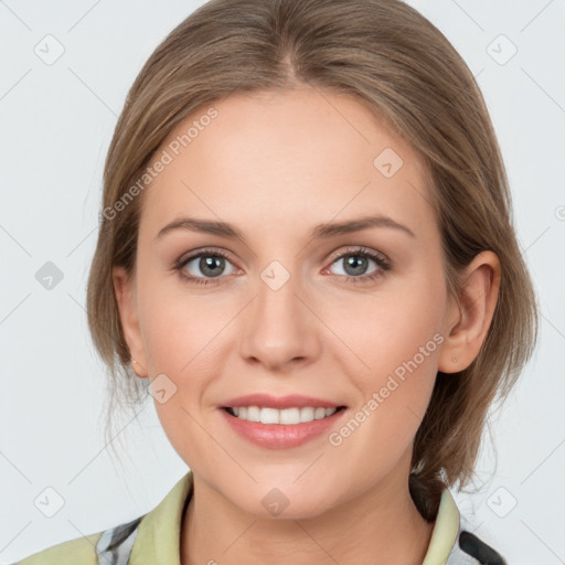 Joyful white young-adult female with medium  brown hair and grey eyes