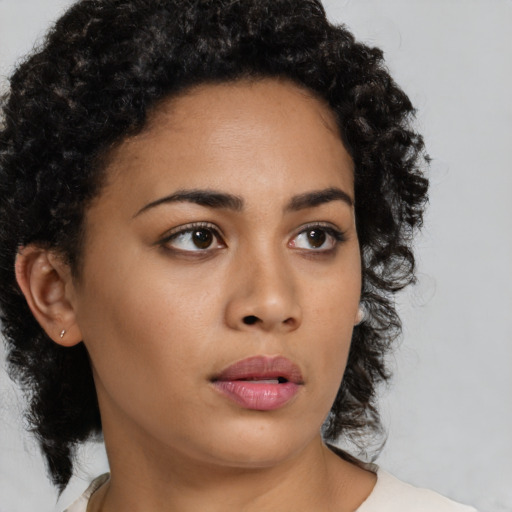 Neutral latino young-adult female with medium  brown hair and brown eyes