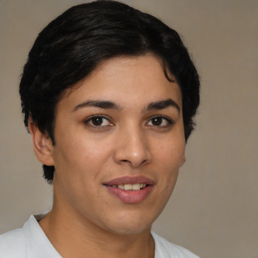 Joyful latino young-adult female with short  brown hair and brown eyes