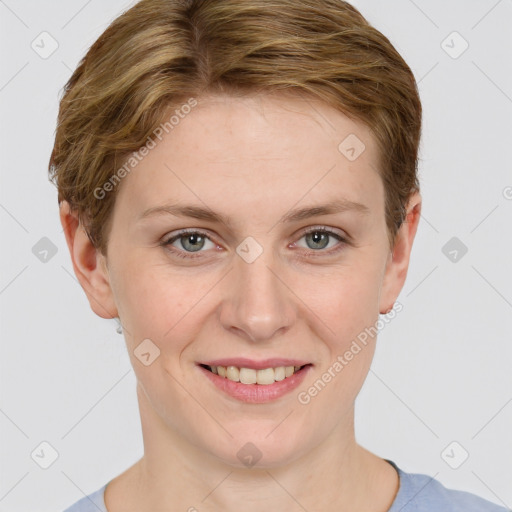 Joyful white young-adult female with short  brown hair and blue eyes