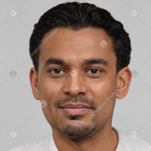 Joyful latino young-adult male with short  black hair and brown eyes