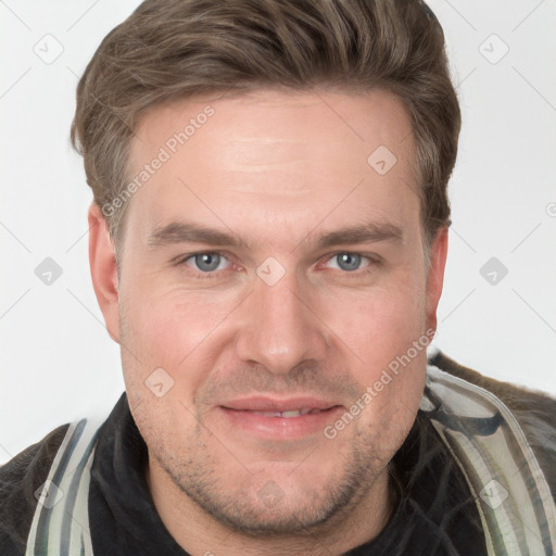 Joyful white adult male with short  brown hair and grey eyes