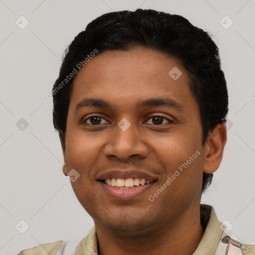 Joyful latino young-adult male with short  black hair and brown eyes