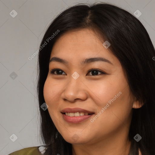 Joyful asian young-adult female with long  brown hair and brown eyes