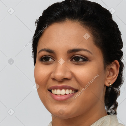 Joyful latino young-adult female with long  brown hair and brown eyes