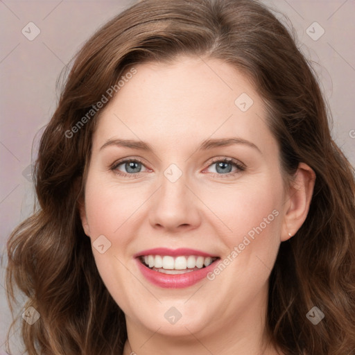 Joyful white young-adult female with long  brown hair and green eyes