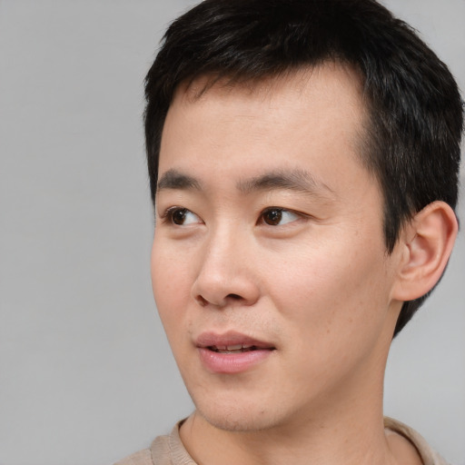 Neutral asian young-adult male with short  black hair and brown eyes