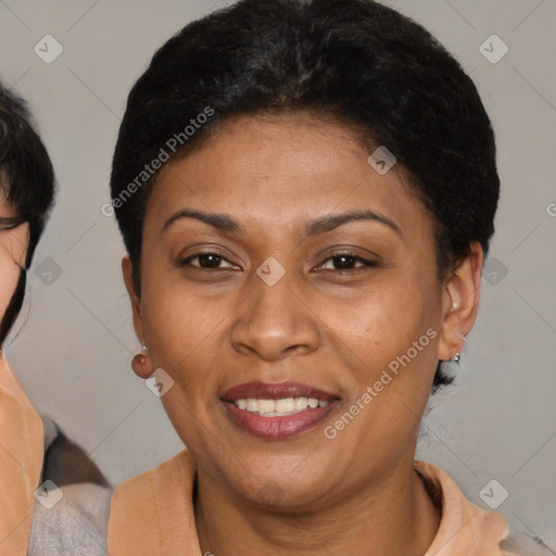 Joyful latino adult female with short  brown hair and brown eyes