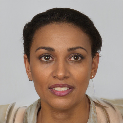 Joyful latino young-adult female with short  brown hair and brown eyes