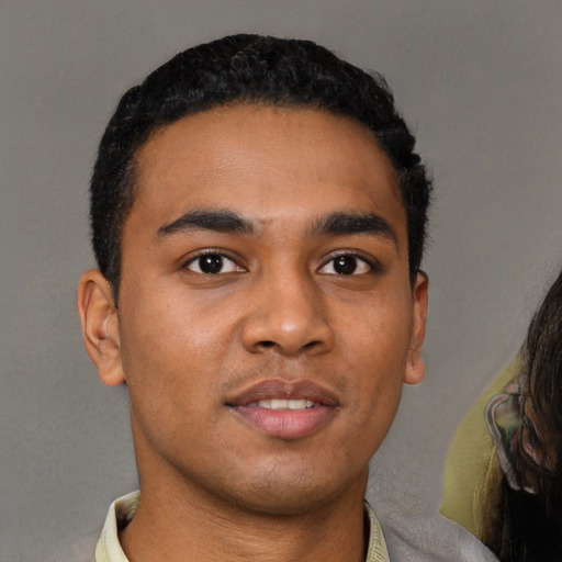 Neutral latino young-adult male with short  black hair and brown eyes