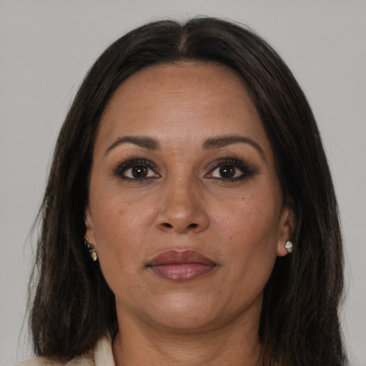 Joyful white adult female with long  brown hair and brown eyes
