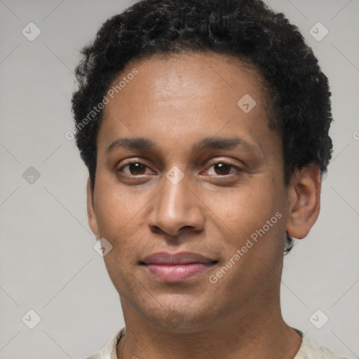 Joyful latino young-adult male with short  brown hair and brown eyes