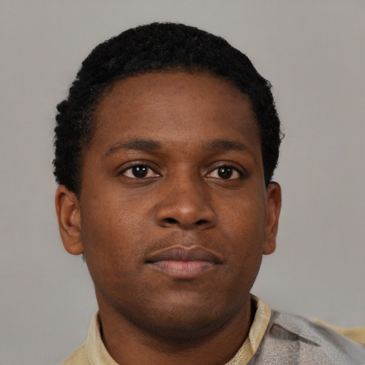 Neutral black young-adult male with short  brown hair and brown eyes