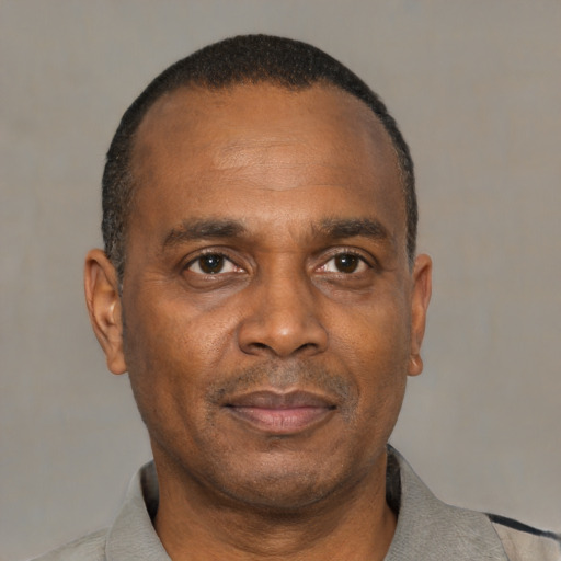 Neutral black adult male with short  black hair and brown eyes