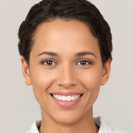 Joyful white young-adult female with short  brown hair and brown eyes