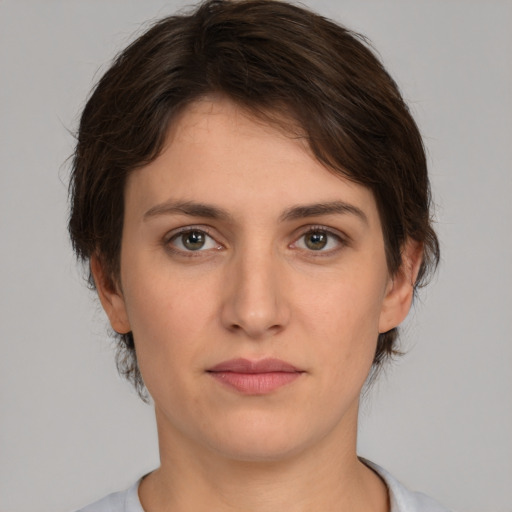 Neutral white young-adult female with medium  brown hair and brown eyes