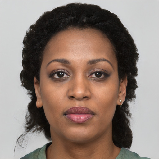 Neutral black young-adult female with medium  black hair and brown eyes