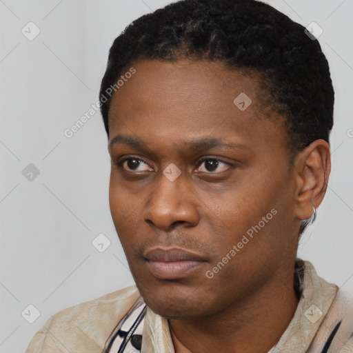 Neutral latino young-adult male with short  black hair and brown eyes