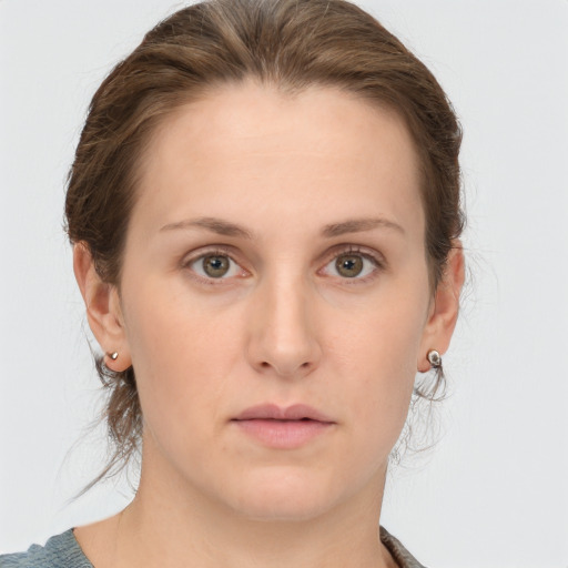 Neutral white young-adult female with medium  brown hair and grey eyes