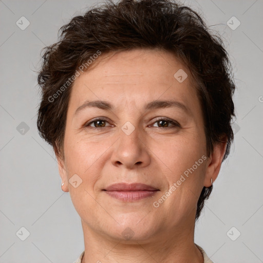 Joyful white adult female with short  brown hair and brown eyes