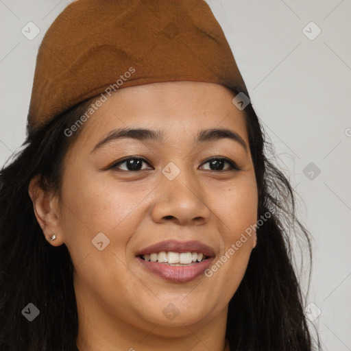 Joyful black young-adult female with long  brown hair and brown eyes