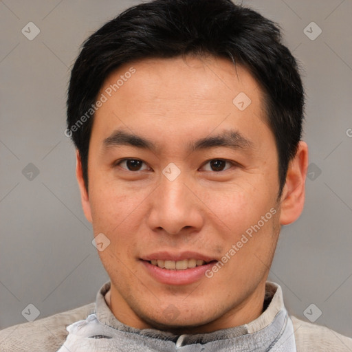 Joyful asian young-adult male with short  brown hair and brown eyes