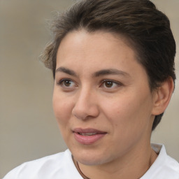 Joyful white adult female with short  brown hair and brown eyes